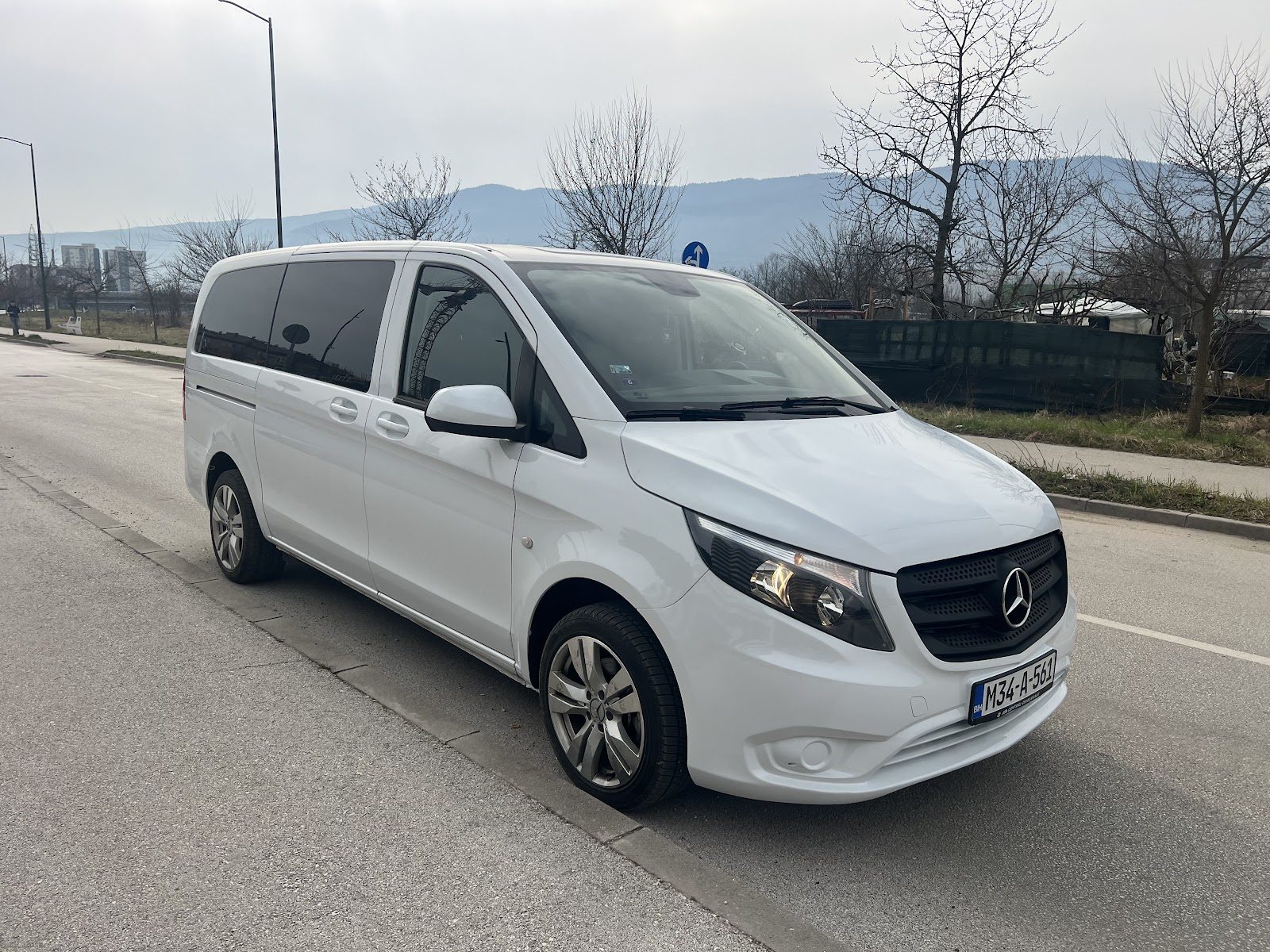 White Mercedes-Benz Vito van from Enjoy Bosnia on a road near Sarajevo